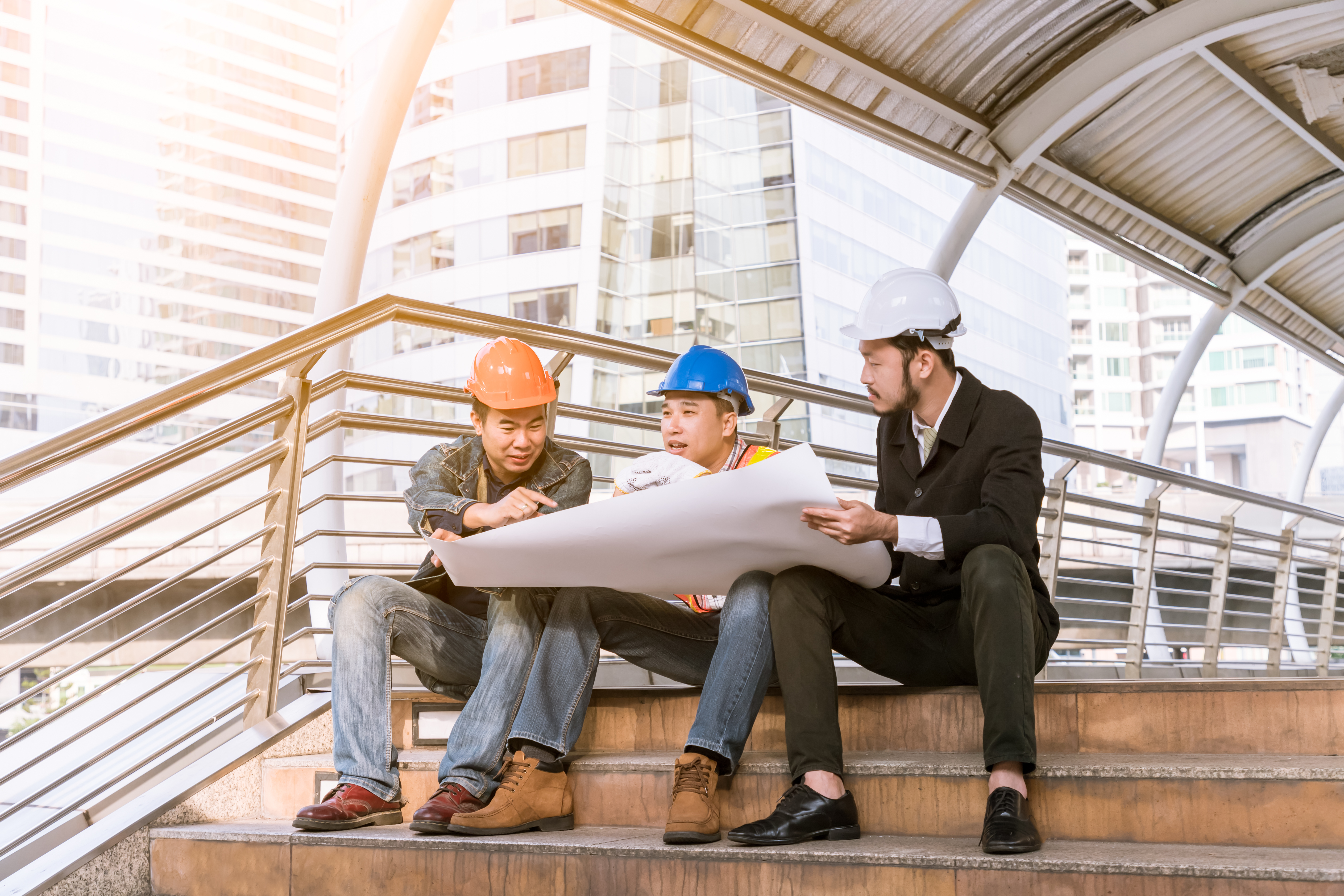 Surveying professional discussing field measurements on-site